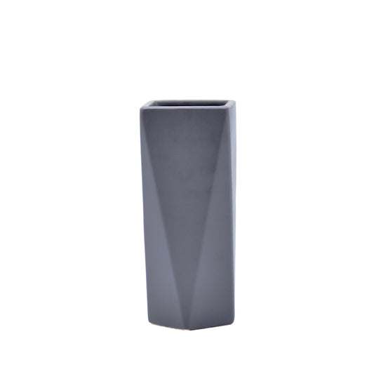 Modern geometric ceramic flower vase with yellow floral arrangement for luxury contemporary Indian home décor
