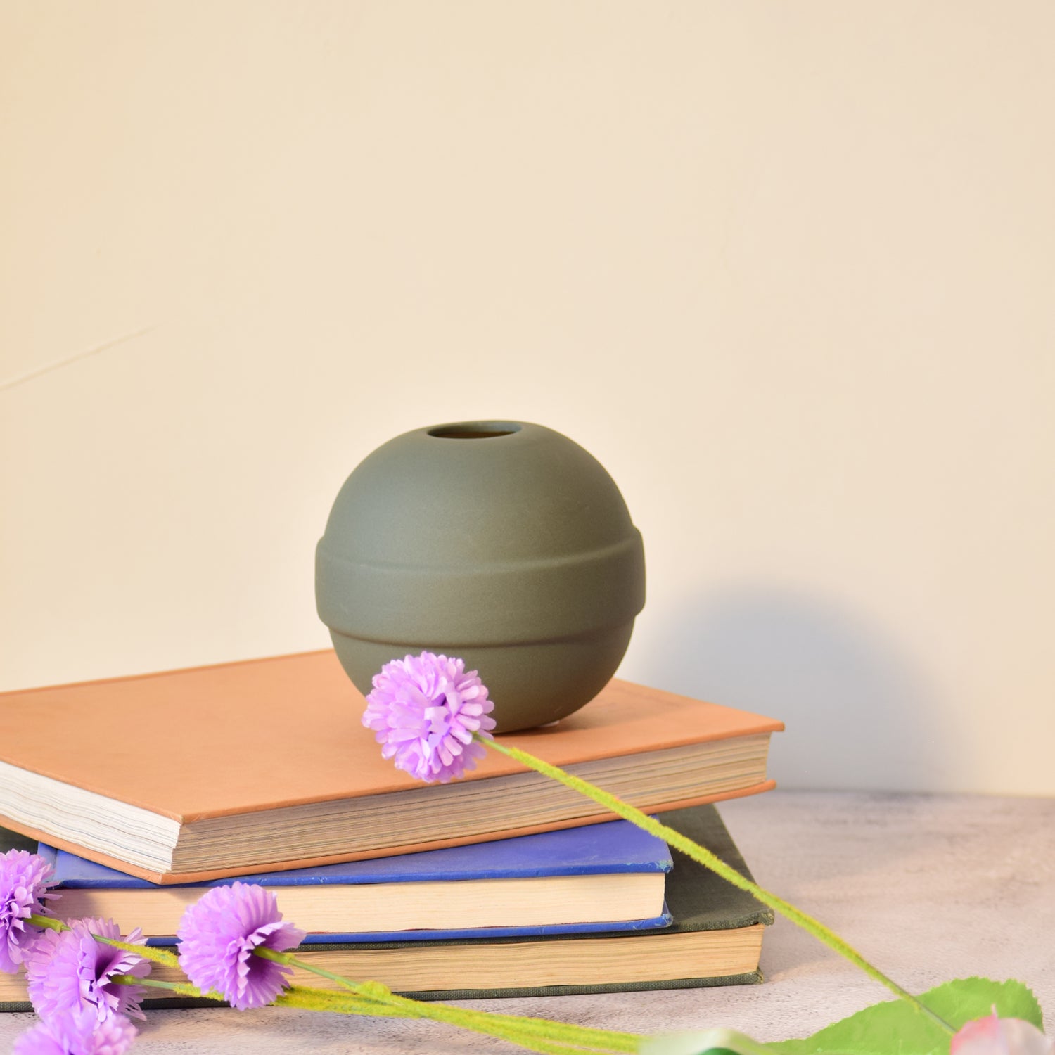 Modern ceramic Pokémon ball vase with baby breath flowers on wooden desk in aesthetic home interior