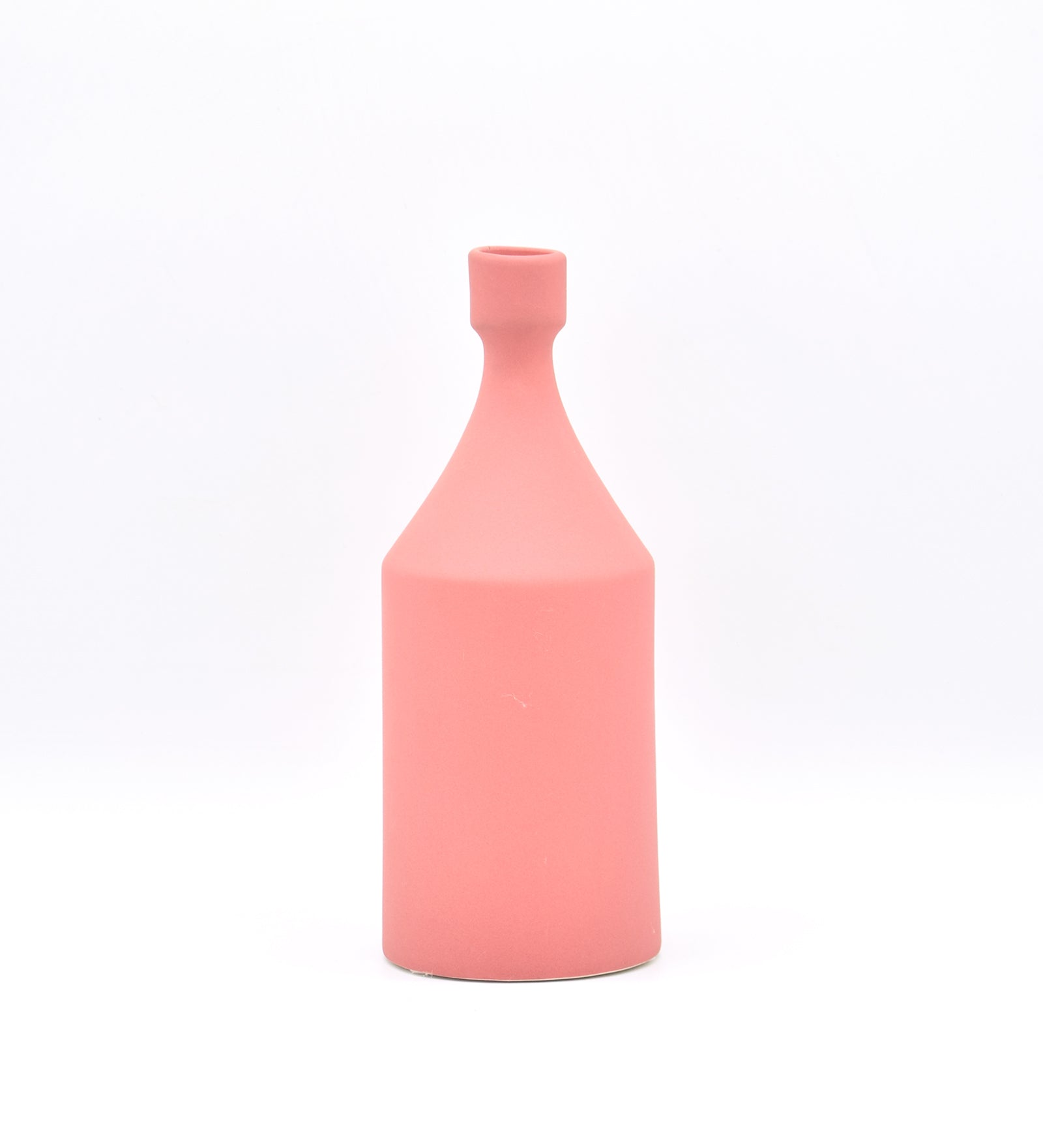 Luxury ceramic bottle-shaped vase with matte finish styled on a beige travertine console table in a modern Scandinavian-inspired interior with olive branches and minimalist décor.
